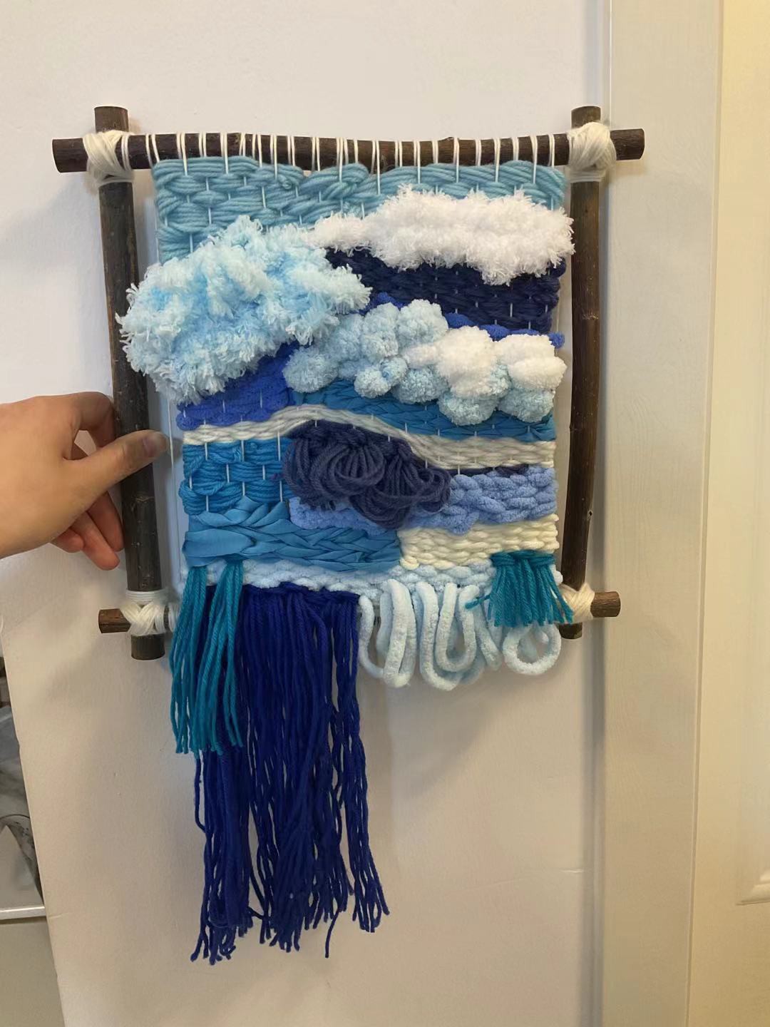 A woven pendant in blue colour